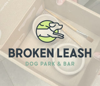 Product packaging with 'Broken Leash Dog Park & Bar' branding and a dog illustration.