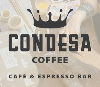 Promotional image for Condesa Coffee Cafe & Espresso Bar with a blurred background of hands sculpting pottery