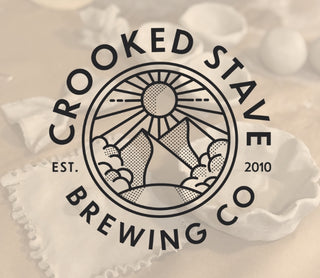 Crooked Stave Brewing Co logo on a blurred background of ceramic items