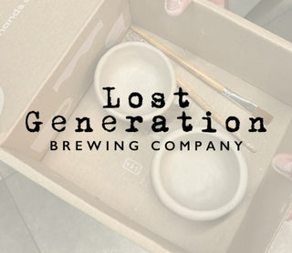 White ceramic items in a box with 'Lost Generation Brewing Company' text.