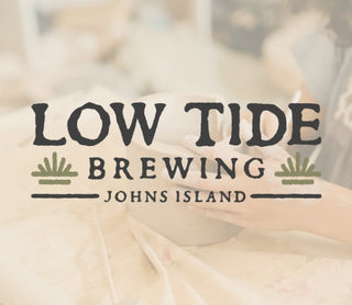 Low Tide Brewing logo with a blurred background