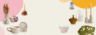 Collection of ceramic items including mugs, vases, and decorative pieces on a light background.