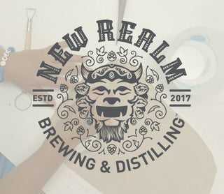 New Realm Brewing & Distilling logo on a white background