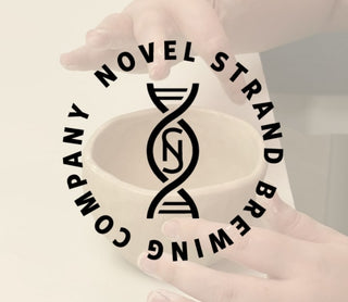 Novel Strand Brewing Company logo on a product with hands holding it.