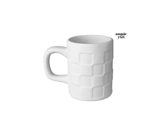 A white ceramic mug with a textured embossed basketweave pattern, shown on a plain white background with a small text overlay reading 'amnie y'all'.