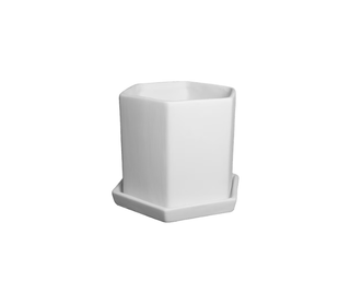 A white hexagonal ceramic cup with a matching saucer, shown on a plain white background.