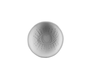 A round ceramic dish featuring an embossed eye with a heart-shaped pupil and radiating rays, set against a plain white background.