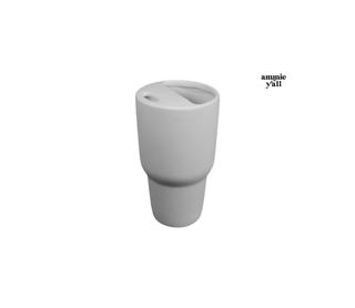 A light gray ceramic travel tumbler with a matching lid, shown on a plain white background with the text 'amnie y'all' in the upper right.