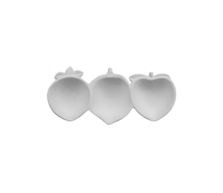 Three small white fruit-shaped items, resembling strawberries and a peach, arranged side by side on a plain white background.