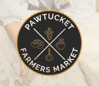 Logo of Pawtucket Farmers Market with crosshairs and food icons on a black background.