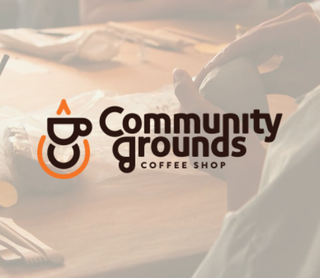 A warm-toned, slightly hazy photo of a person pouring coffee at a wooden table, with the overlaid logo and text 'Community grounds COFFEE SHOP' in the center.