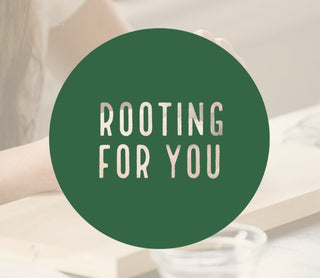 Green circle with 'Rooting For You' text on a blurred background