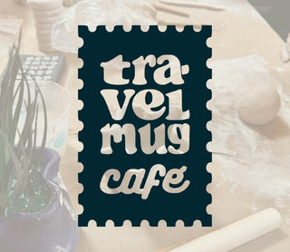 Sign with 'travel mug cafe' text on a decorative background