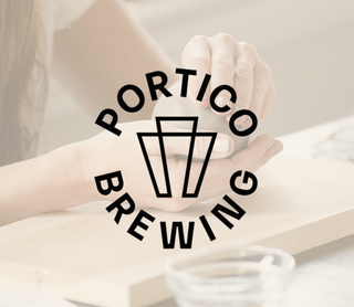 A black circular logo reading 'PORTICO BREWING' with a stylized beer glass icon in the center, overlaid on a softly blurred lifestyle photo of hands holding a mug on a table.