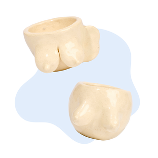 Two beige ceramic pots on a white background