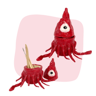 Red octopus-shaped container with smaller versions on a pink background