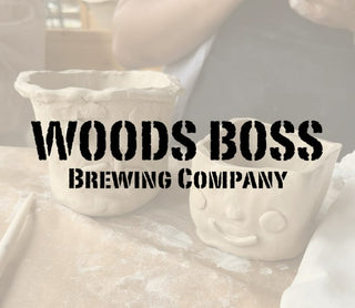 Two ceramic owl pots with 'Woods Boss Brewing Company' text on a neutral background
